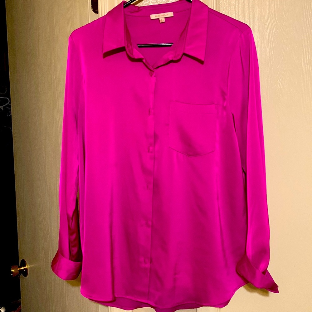 Long sleeve hot pink button down blouse.